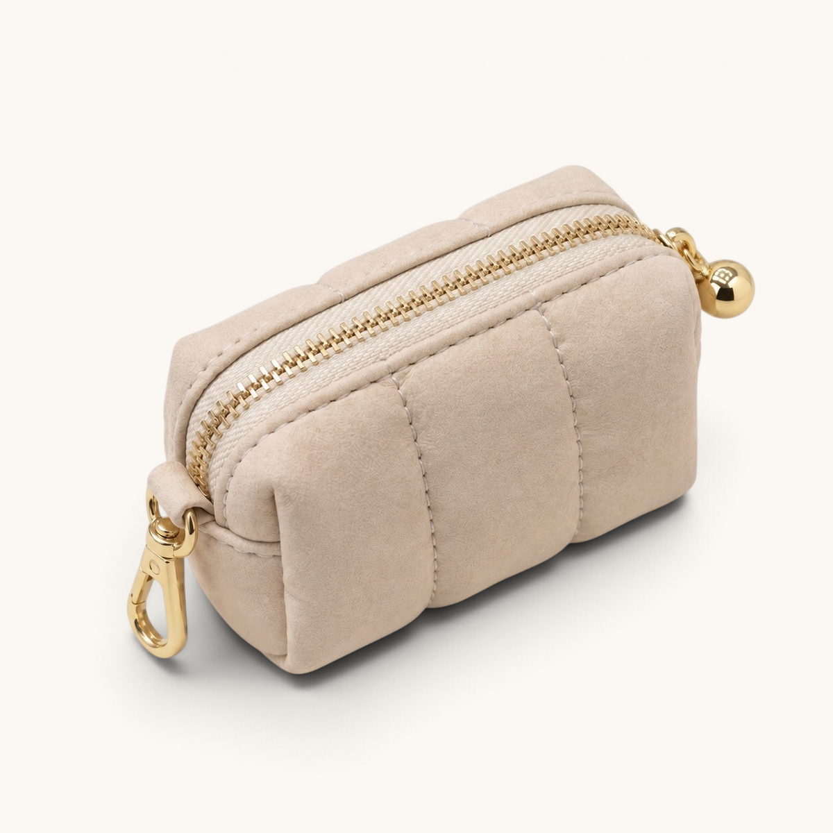 Feetz & Co. beige quilted suede-feel puffy pouch with a gold zipper and clip for keys or bags