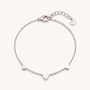 Feetz & Co. Amore silver-tone stainless steel anklet featuring three delicate heart charms on a fine cable chain.