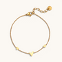 Feetz & Co. Amore gold-tone stainless steel anklet featuring three delicate heart charms on a fine cable chain.