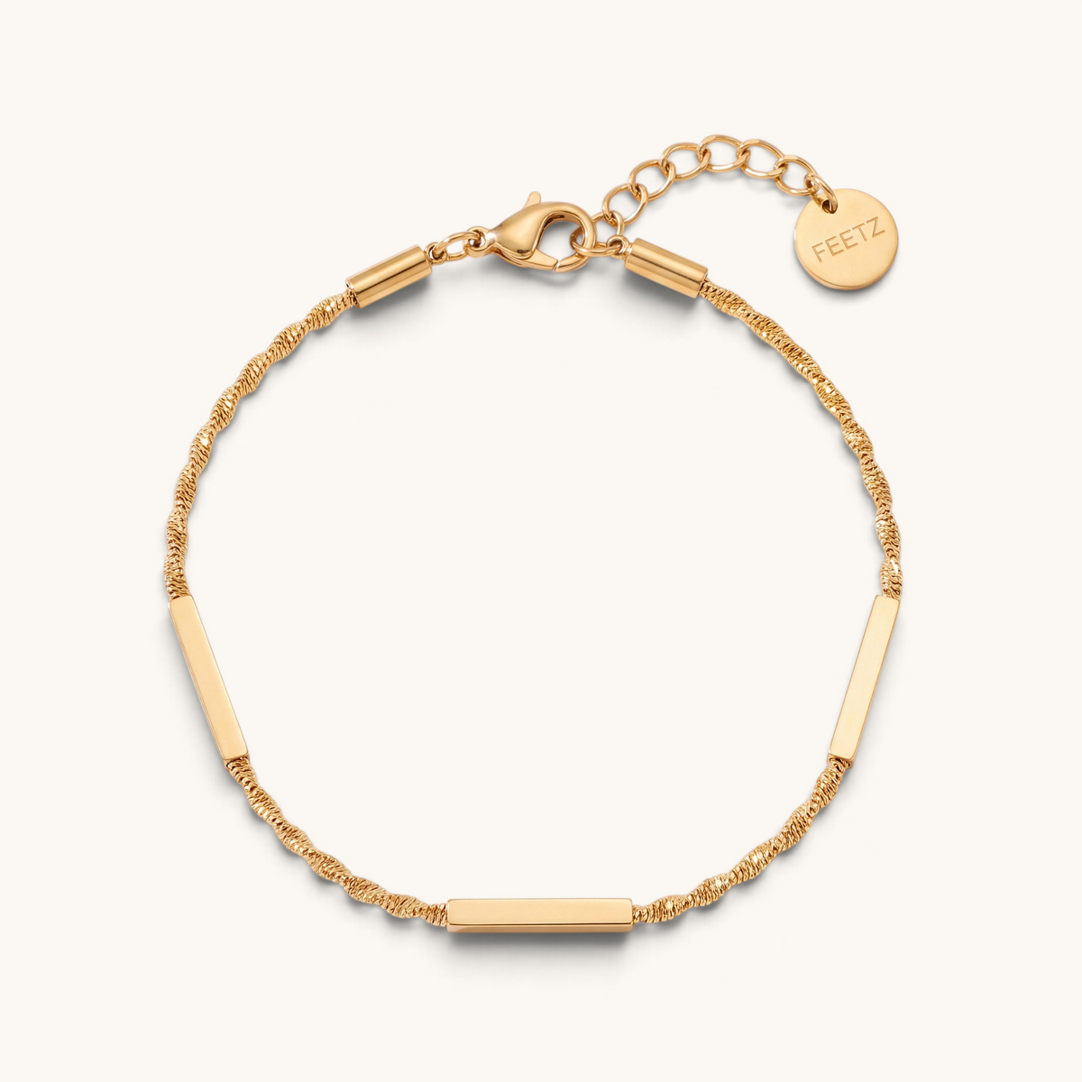 Feetz & Co. Asta gold-tone stainless steel anklet featuring three polished flat bars on a delicate sparkling chain.