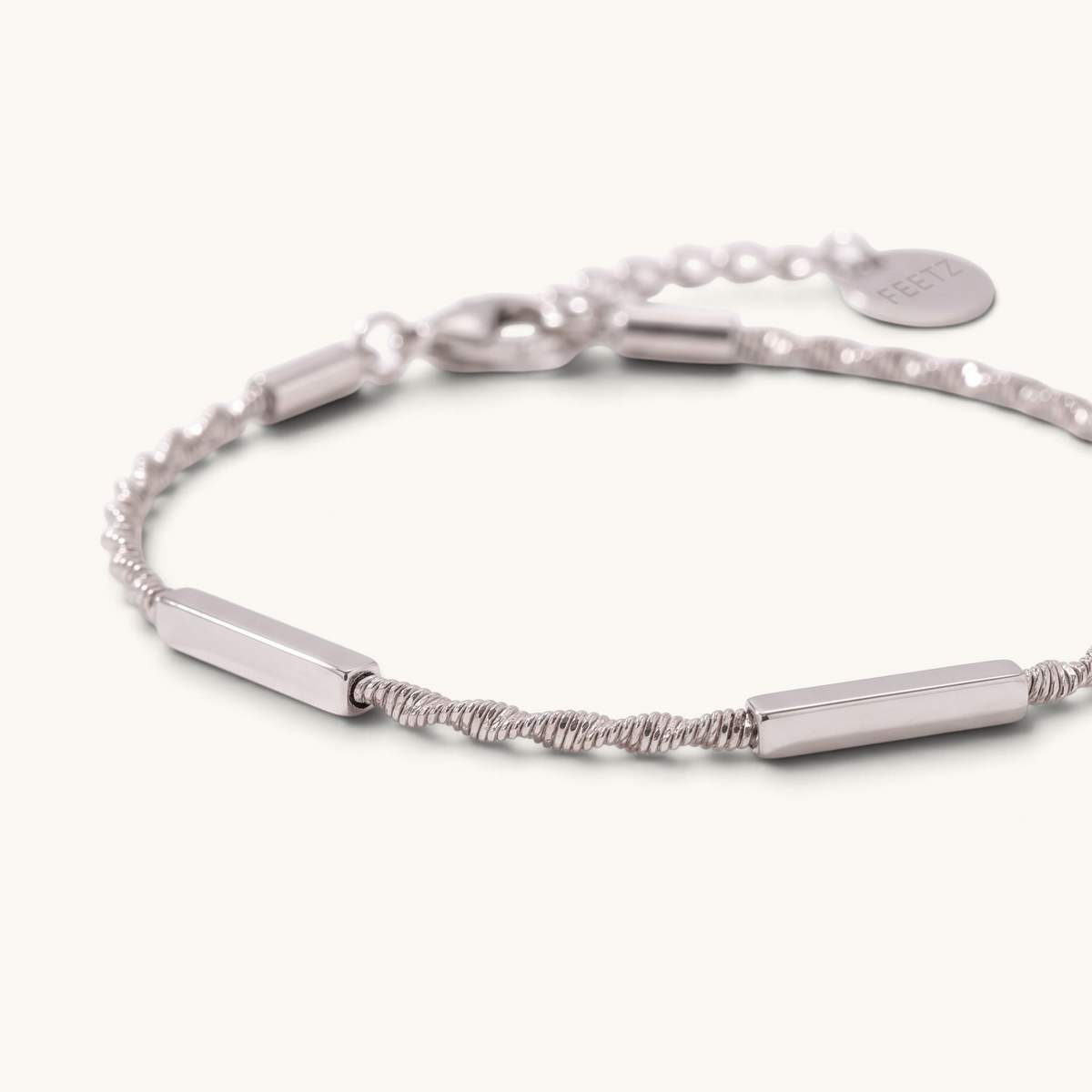 Feetz & Co. Asta anklet in silver stainless steel featuring three polished flat bars on a sparkling twisted chain.