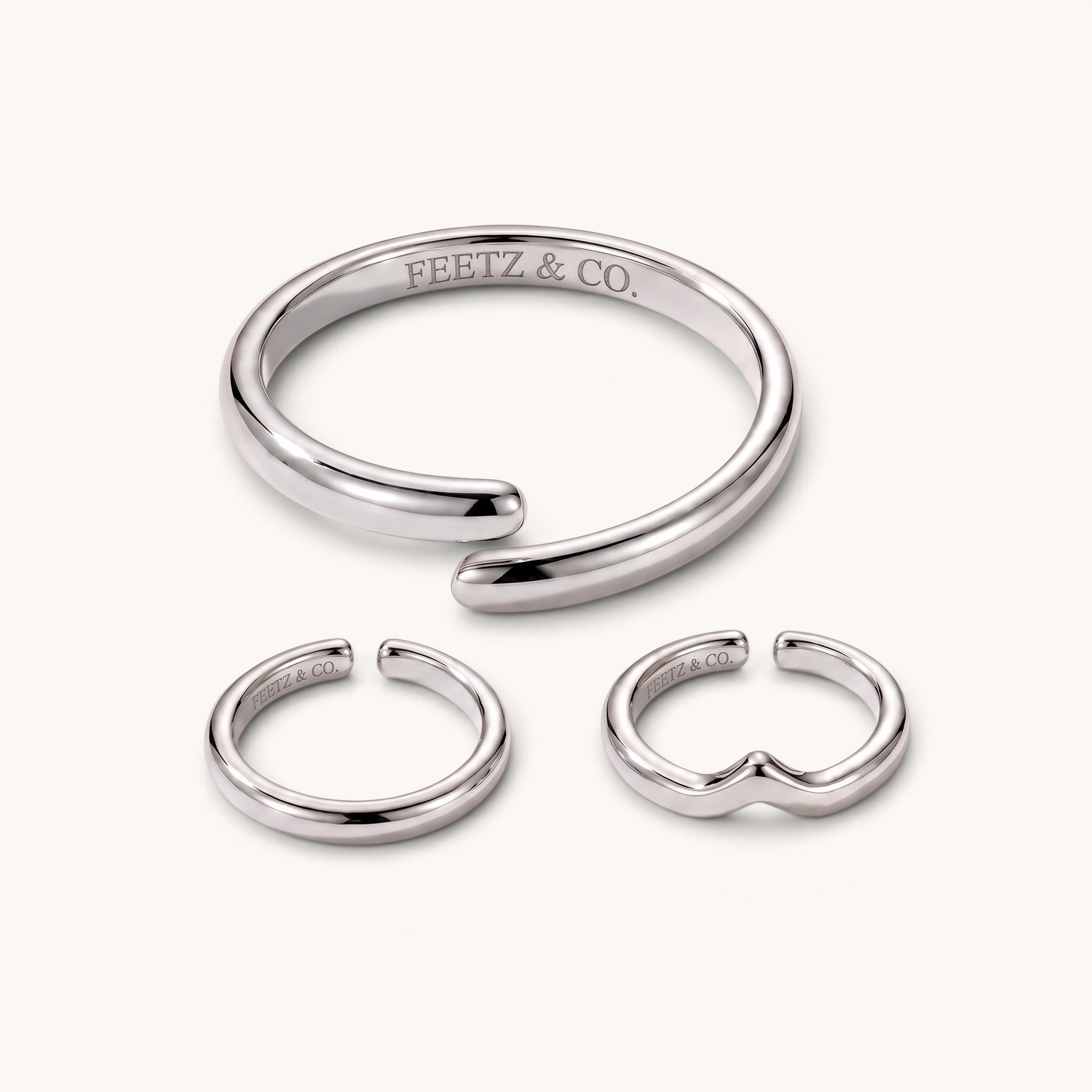 Feetz & Co. silver-plated stainless steel toe ring stack featuring three adjustable open bands in a smooth finish.