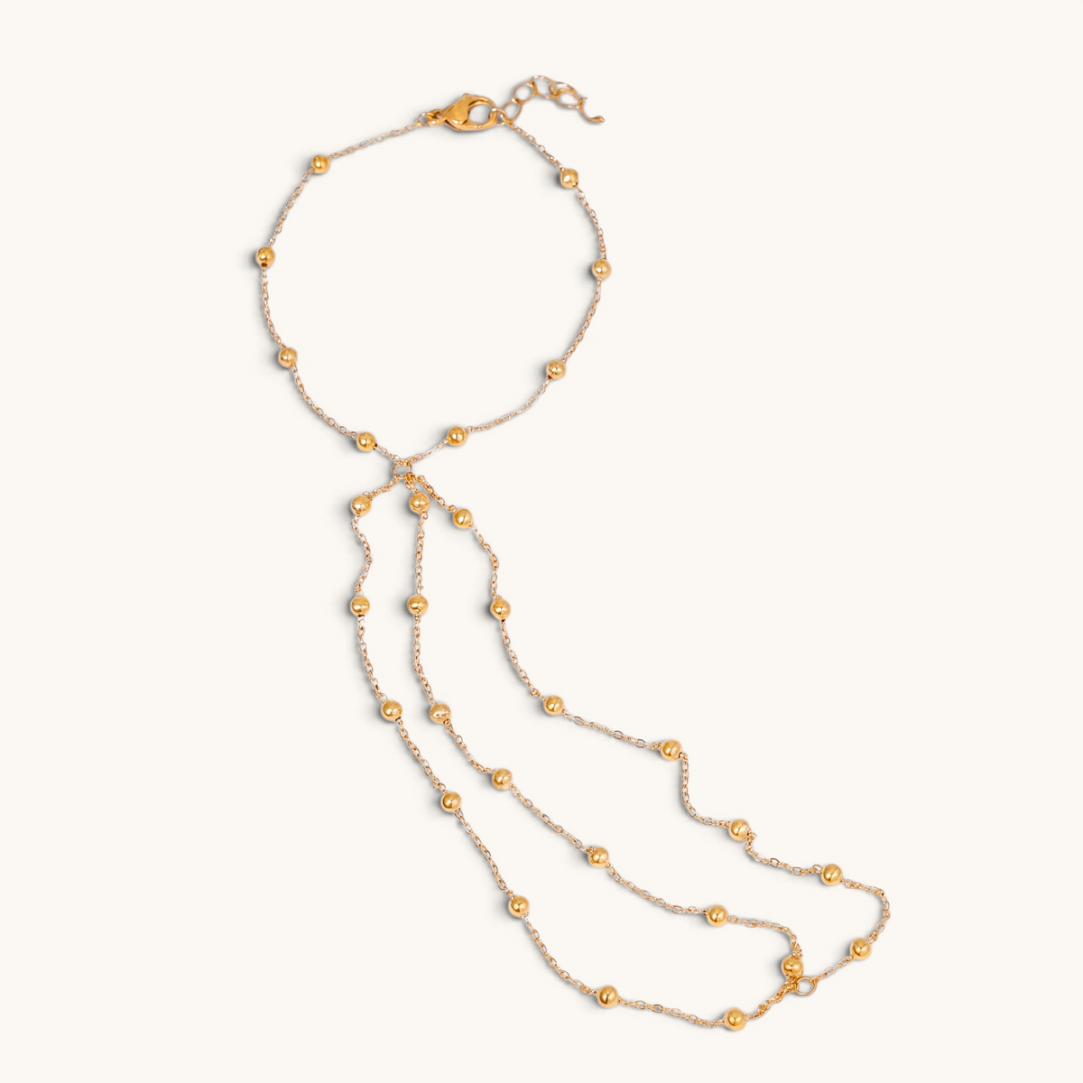 Feetz & Co. gold-plated stainless steel beaded barefoot sandal with multi-strand design and toe loop