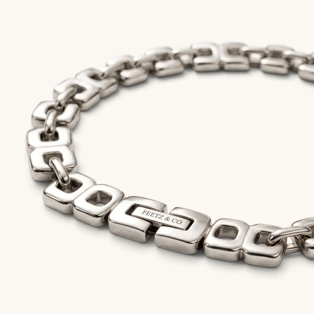 Feetz & Co. Bloc Anklet featuring bold silver-plated stainless steel squared links with a secure branded clasp.