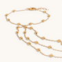 Feetz & Co. Cascade gold-plated stainless steel barefoot sandal with layered beaded chains and a toe loop.