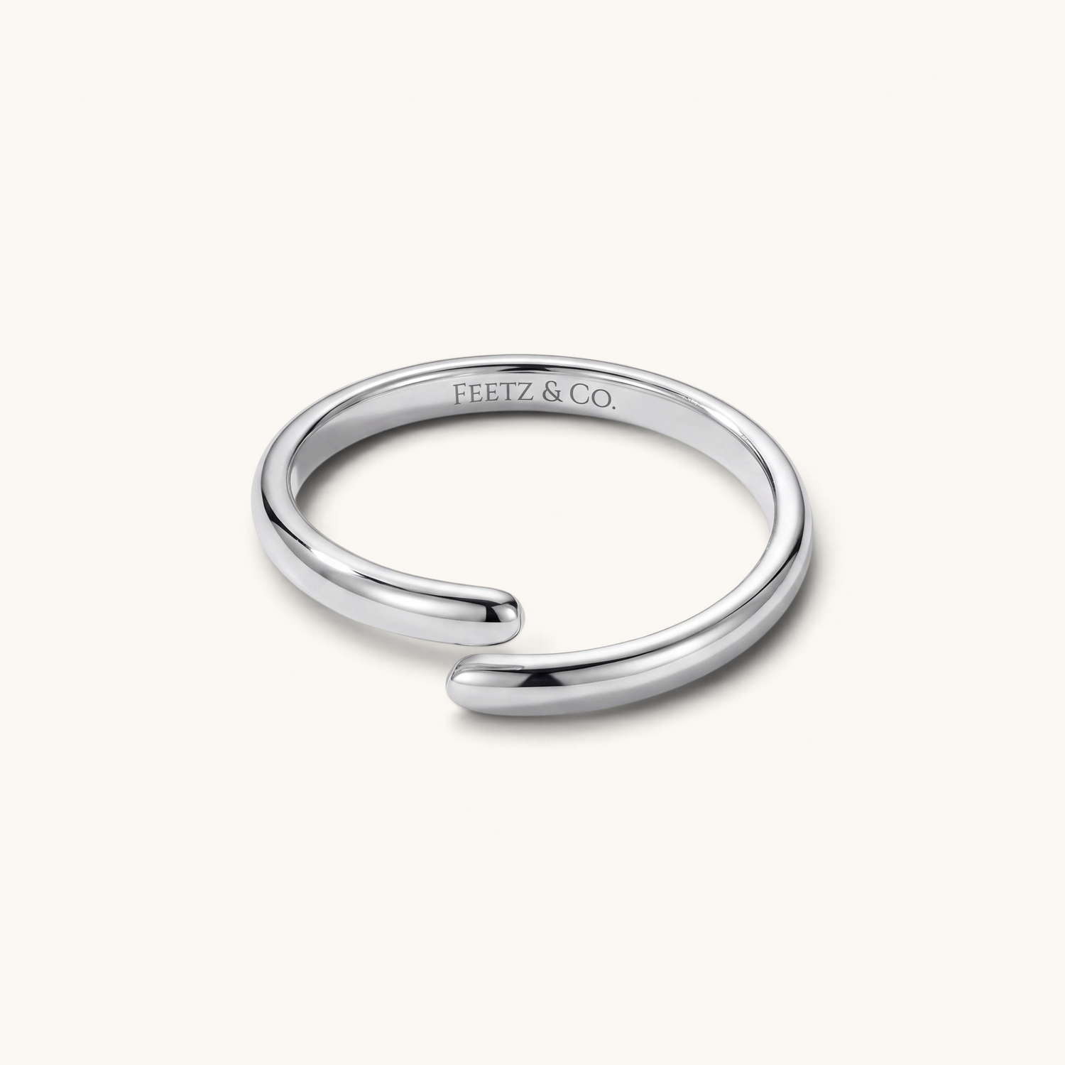 Feetz & Co. Curva adjustable big toe ring in polished silver-tone stainless steel with a minimalist curved design.