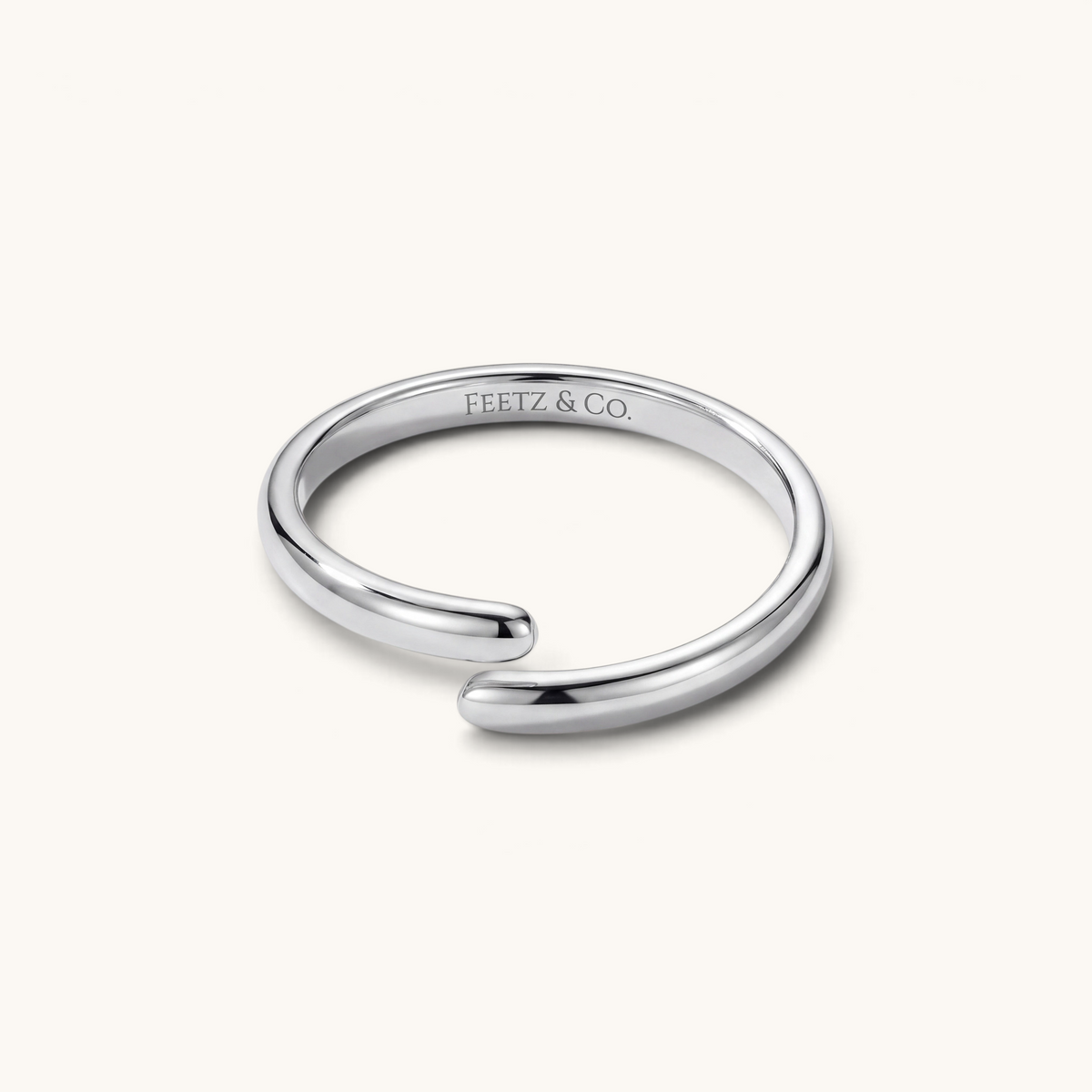 Feetz & Co. Curva adjustable big toe ring in polished silver-tone stainless steel with a minimalist curved design.