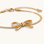 Feetz & Co. Eterna gold herringbone chain anklet featuring a delicate flat bow design in polished stainless steel.