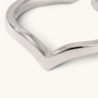 Feetz & Co. silver-plated stainless steel arrow toe ring with a minimal architectural V-peak design