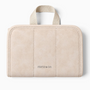 Feetz & Co. beige suede-feel jewelry travel folder with a top handle and embossed logo, closed view.
