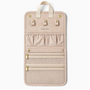 Feetz & Co. beige suede-feel jewelry travel folder with ring holders, mesh zip pockets, and gold snap closures.