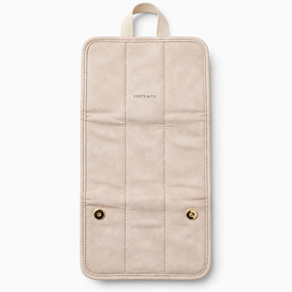 Feetz & Co. beige suede-feel jewelry travel folder with gold snap buttons and embossed logo, shown open.