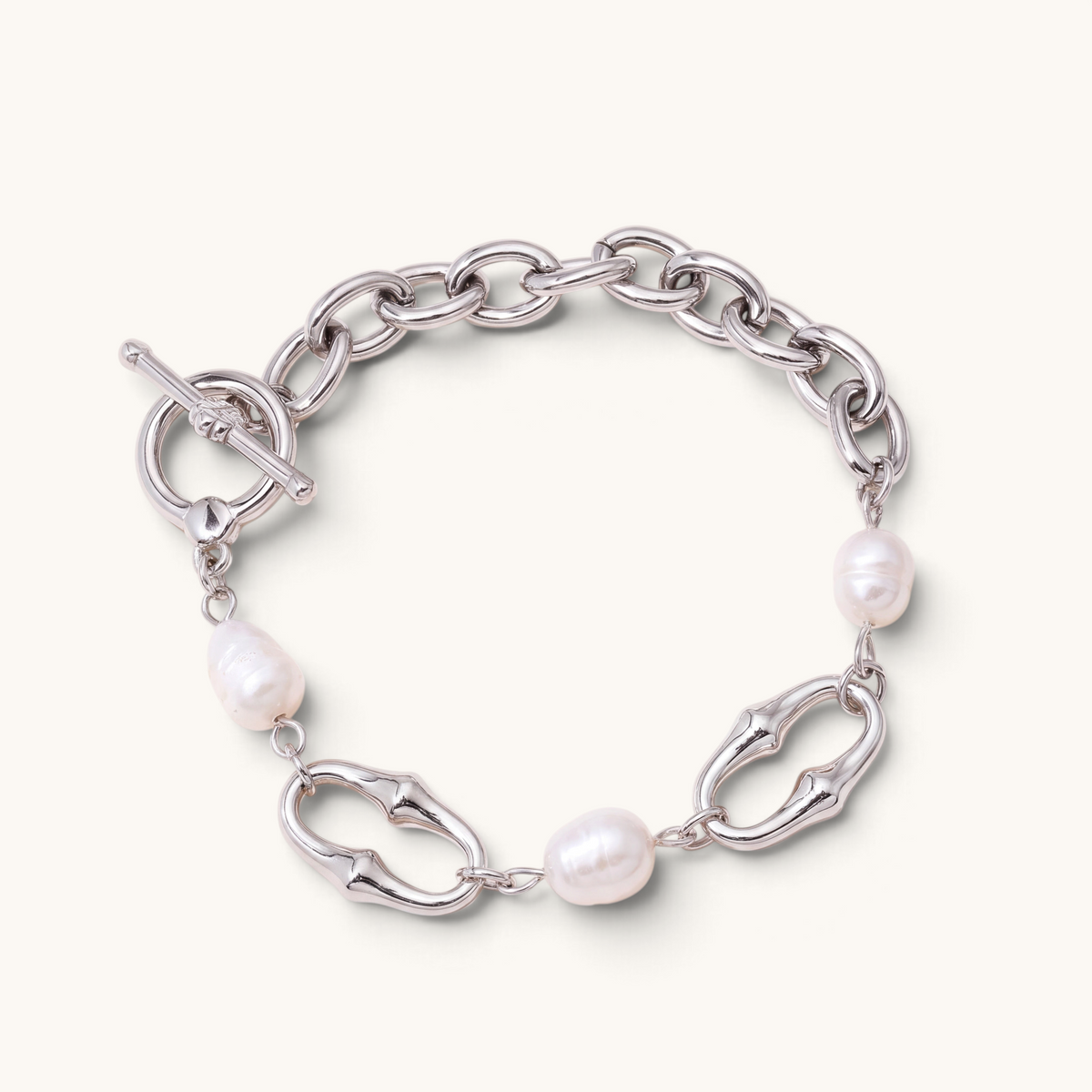 Feetz & Co. Perla anklet featuring a silver-tone stainless steel oval-link chain with natural baroque freshwater pearls.