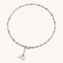 Feetz & Co. Pia anklet featuring a delicate silver-plated stainless steel chain with a freshwater pearl drop charm.