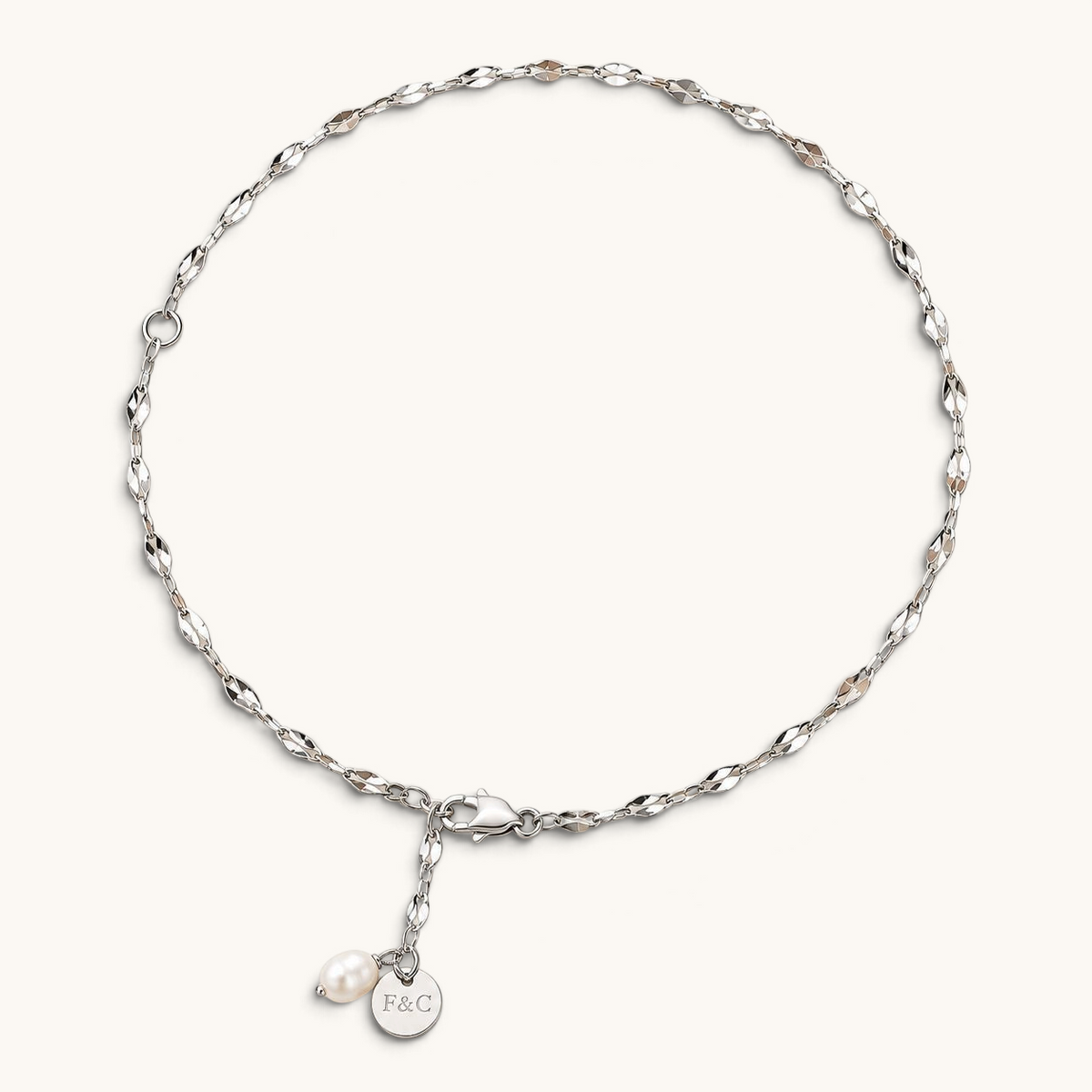 Feetz & Co. Pia anklet featuring a delicate silver-plated stainless steel chain with a freshwater pearl drop charm.