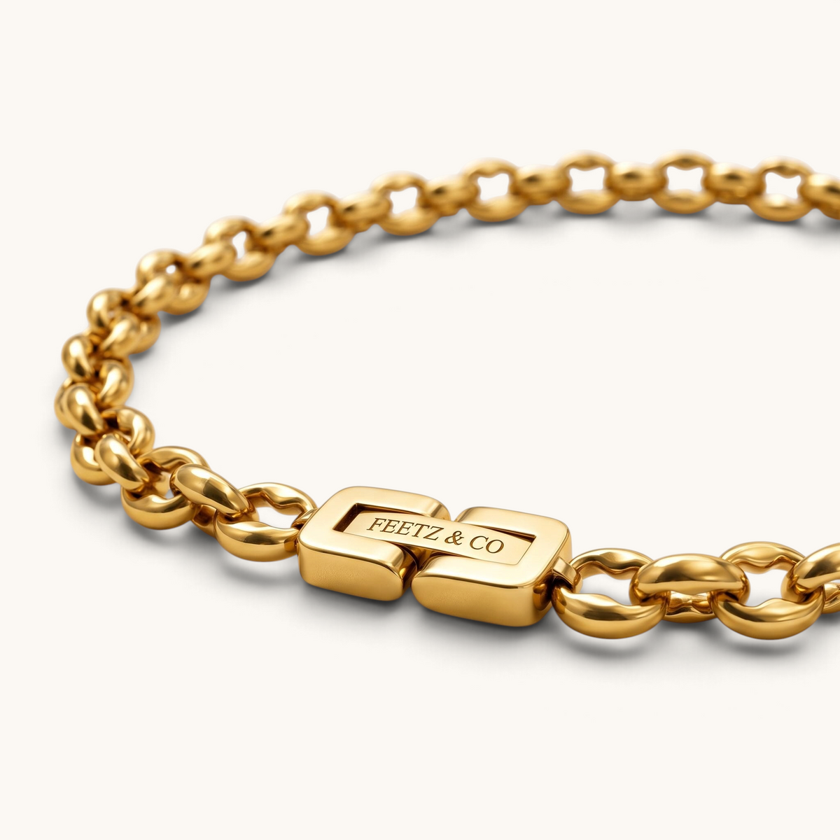 Feetz & Co. Remi Anklet featuring a polished 18K gold-plated stainless steel rolo chain with a branded clasp.