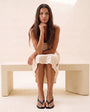 Ciel Anklet Gold — Seated lifestyle shot
