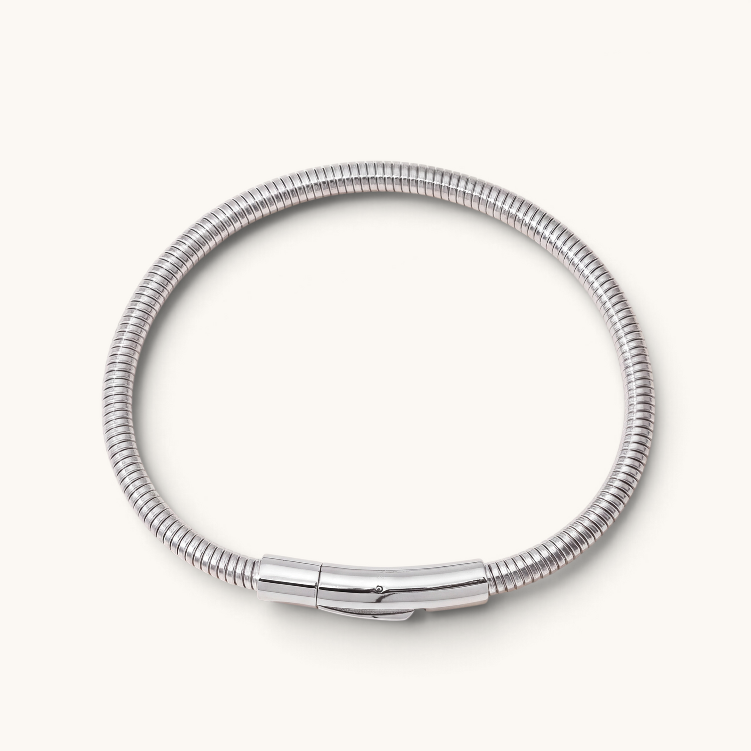 Feetz & Co. Viper anklet in polished silver stainless steel with a ribbed, flexible tube design and secure clasp.